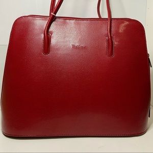 This is a Tuci Italia Red Purse